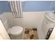 Cozy half bath featuring a classic towel rack and charming wainscoting detail at 108 Mitchell Pl # 108, Daytona Beach, FL 32118