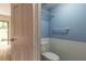 Cozy half bath with white wainscoting, blue walls, and a sleek sink at 108 Mitchell Pl # 108, Daytona Beach, FL 32118