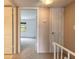 Upstairs hallway view of a bedroom with carpet and white doors at 108 Mitchell Pl # 108, Daytona Beach, FL 32118