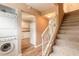 Conveniently located laundry area near the kitchen and carpeted stairs at 108 Mitchell Pl # 108, Daytona Beach, FL 32118