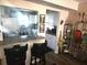 Updated kitchen featuring a breakfast bar with bar stools, sleek counters, and modern appliances at 108 Mitchell Pl # 108, Daytona Beach, FL 32118