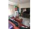 A comfortable living room with a large TV, sectional sofa, and modern decor at 108 Mitchell Pl # 108, Daytona Beach, FL 32118