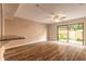 Bright living room with wood floors, sliding glass doors, and granite countertop in view at 108 Mitchell Pl # 108, Daytona Beach, FL 32118