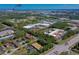 Aerial view of complex showcasing location near retail, airport and medical facilities at 112 Lacosta Ln # 115, Daytona Beach, FL 32114