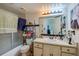 Functional bathroom featuring a shower-tub combination and storage vanity at 112 Lacosta Ln # 115, Daytona Beach, FL 32114