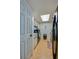 Efficient kitchen featuring a skylight and essential appliances at 112 Lacosta Ln # 115, Daytona Beach, FL 32114