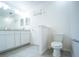 Bright white bathroom with double sink vanity, tile floor and toilet at 1162 Prescott Blvd, Deltona, FL 32738