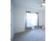 Empty bedroom with a ceiling fan, carpet and window at 1162 Prescott Blvd, Deltona, FL 32738