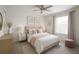 Calming bedroom with neutral tones, a ceiling fan, and large window at 1162 Prescott Blvd, Deltona, FL 32738