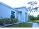 Close up of the entrance of a single Gathering home with a well-manicured lawn at 1162 Prescott Blvd, Deltona, FL 32738