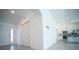 Bright entryway featuring tile floors, closet space, and an open view into the kitchen at 1162 Prescott Blvd, Deltona, FL 32738