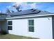 Exterior view of home featuring solar panels on the roof and a stucco exterior at 1162 Prescott Blvd, Deltona, FL 32738