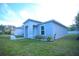 Close up of the entrance of a single Gathering home with a well-manicured lawn at 1162 Prescott Blvd, Deltona, FL 32738