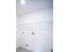 Functional laundry room with wire shelf storage and utility connections at 1162 Prescott Blvd, Deltona, FL 32738