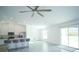 Bright and airy living room with tile flooring, ceiling fan and open access to the kitchen at 1162 Prescott Blvd, Deltona, FL 32738