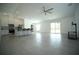 Spacious living room features an open floor plan, tile flooring, and sliding glass doors to the backyard at 1162 Prescott Blvd, Deltona, FL 32738