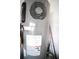 Water heater and plumbing with some fishing rods standing nearby at 1162 Prescott Blvd, Deltona, FL 32738