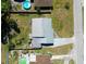 Aerial view of a home with a metal roof, showcasing the layout of the property and surrounding neighborhood at 1199 Galgano Ave, Deltona, FL 32725