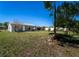 A verdant backyard with plenty of tree coverage and a utility shed at 1199 Galgano Ave, Deltona, FL 32725