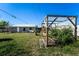 Spacious backyard with a functional chicken coop, ideal for enjoying outdoor activities and hobby farming at 1199 Galgano Ave, Deltona, FL 32725