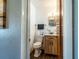 Bright bathroom features a wood vanity and updated fixtures at 1199 Galgano Ave, Deltona, FL 32725