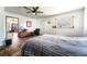 Spacious bedroom with hardwood floors, a ceiling fan, and natural light from the window at 1199 Galgano Ave, Deltona, FL 32725