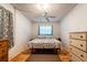 Cozy bedroom featuring a beach-themed bedding and a ceiling fan for added comfort at 1199 Galgano Ave, Deltona, FL 32725