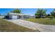 A single-story home featuring a garage and front yard at 1199 Galgano Ave, Deltona, FL 32725