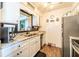 Bright kitchen with stainless steel appliances and granite countertops at 1199 Galgano Ave, Deltona, FL 32725