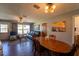 Combined living and dining area with wood floors, ample natural light, and comfortable seating at 1199 Galgano Ave, Deltona, FL 32725