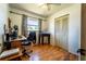 Home office with hardwood floors, a window, and a closet, perfect for work or study at 1199 Galgano Ave, Deltona, FL 32725