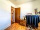 This office area has hardwood floors and a desk area with an open doorway to the hallway at 1199 Galgano Ave, Deltona, FL 32725