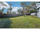 Spacious backyard perfect for outdoor activities and relaxation under a shade tree at 1265 Aquarius Ave, Deland, FL 32724