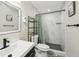Modern bathroom features a sleek sink and vanity with decorative tiling and stand-up shower at 1265 Aquarius Ave, Deland, FL 32724