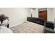 Comfortable bedroom featuring wood flooring, a stylish bed frame, and plenty of natural light at 1265 Aquarius Ave, Deland, FL 32724