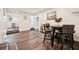 Cozy dining area with hardwood floors and a view into the living room at 1265 Aquarius Ave, Deland, FL 32724