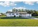 Charming single-story home with a well-maintained lawn and inviting front porch at 1265 Aquarius Ave, Deland, FL 32724