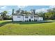 Well-maintained single-story home with mature landscaping and a welcoming front entrance at 1265 Aquarius Ave, Deland, FL 32724