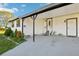 Inviting front porch with an elegant white door and stylish black accents at 1265 Aquarius Ave, Deland, FL 32724