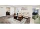 Comfortable living room showcasing an area rug, a warm color palette, and multiple accessways at 1265 Aquarius Ave, Deland, FL 32724