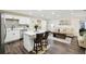 Open living area connecting the kitchen and seating area, perfect for entertaining at 1265 Aquarius Ave, Deland, FL 32724