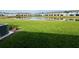 Lush green backyard with a view of the pond and other townhomes in this community at 131 Reena Dr, Daytona Beach, FL 32117