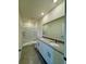 This bathroom is equipped with double sinks, granite countertops, and a shower at 131 Reena Dr, Daytona Beach, FL 32117