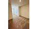 This bedroom features neutral carpet, a window, and a closet at 131 Reena Dr, Daytona Beach, FL 32117