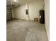 Spacious garage featuring cinder block walls, with the water heater located in the corner at 131 Reena Dr, Daytona Beach, FL 32117