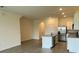Open-concept kitchen with stainless steel appliances, granite counters, and an adjacent living area at 131 Reena Dr, Daytona Beach, FL 32117