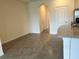 Open-concept living area with tile flooring, neutral walls, and a smooth transition to the kitchen at 131 Reena Dr, Daytona Beach, FL 32117