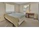 Comfortable bedroom with carpet, a large window, and a neutral color palette at 1320 Bakersfield Ave, Deltona, FL 32725