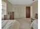 Bedroom with two beds, natural light, and double closet at 1320 Bakersfield Ave, Deltona, FL 32725