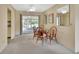 Dining area with table and chairs near a sliding glass door to a porch at 1320 Bakersfield Ave, Deltona, FL 32725